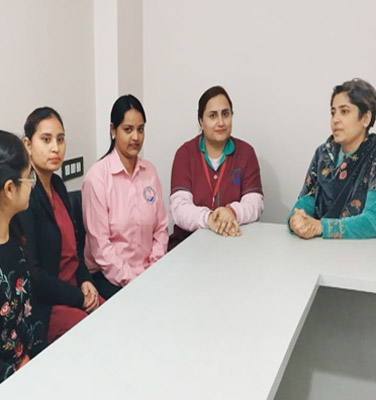 Dr. Meenu Bhanot meeting with thier staff