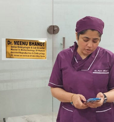 DR Meenu Bhanot Standing at their Office